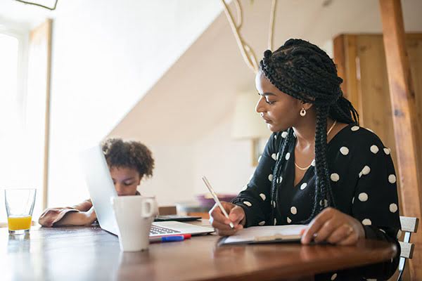 Woman and child with laptop